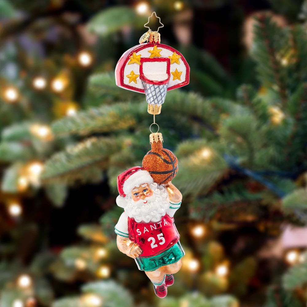 Ornament Description - Baller Santa: Santa has some serious hops! When he's not delivering presents on Christmas Eve, Santa hits the court to show off his basketball skills.