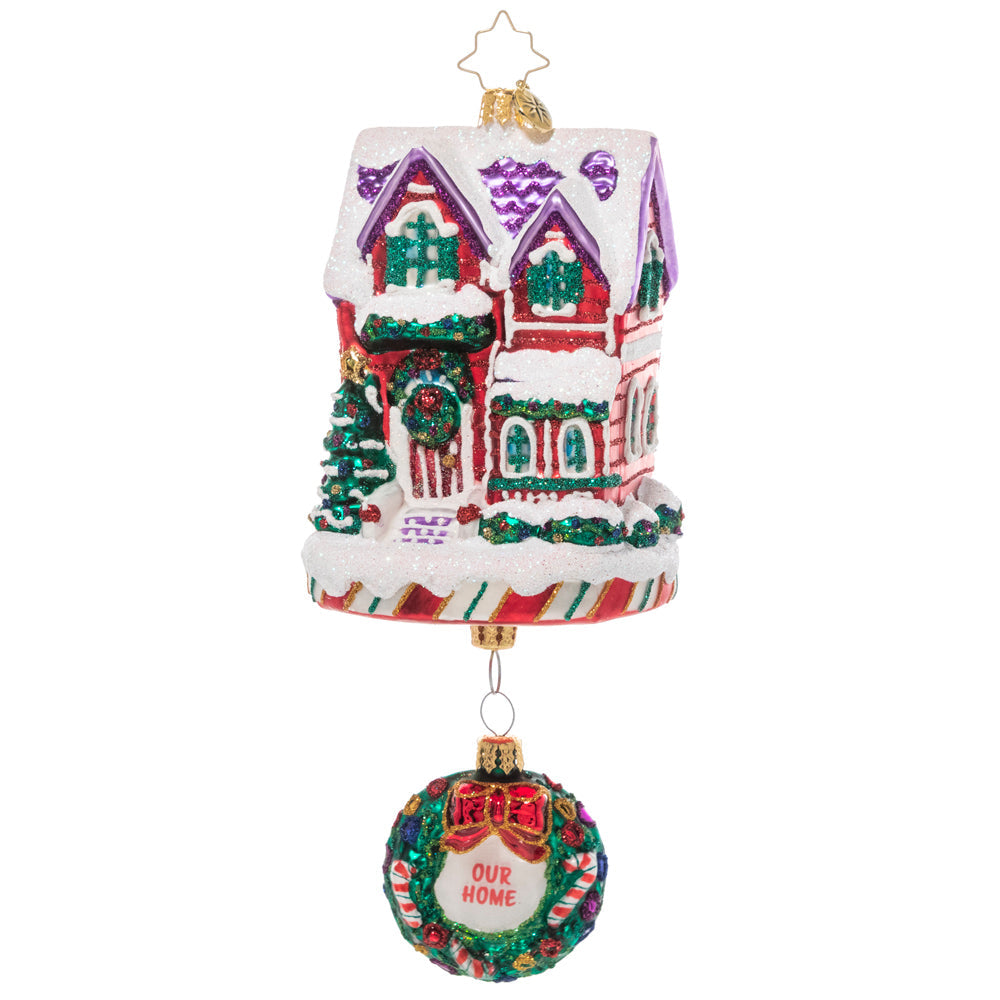Front - Ornament Description - The Claus' Fixer Upper: Santa works hard all year building toys, so he knows all about manual labor. This ornament features Santa and Mrs. Claus fixing up their house – perfect for the handy new homeowner. 