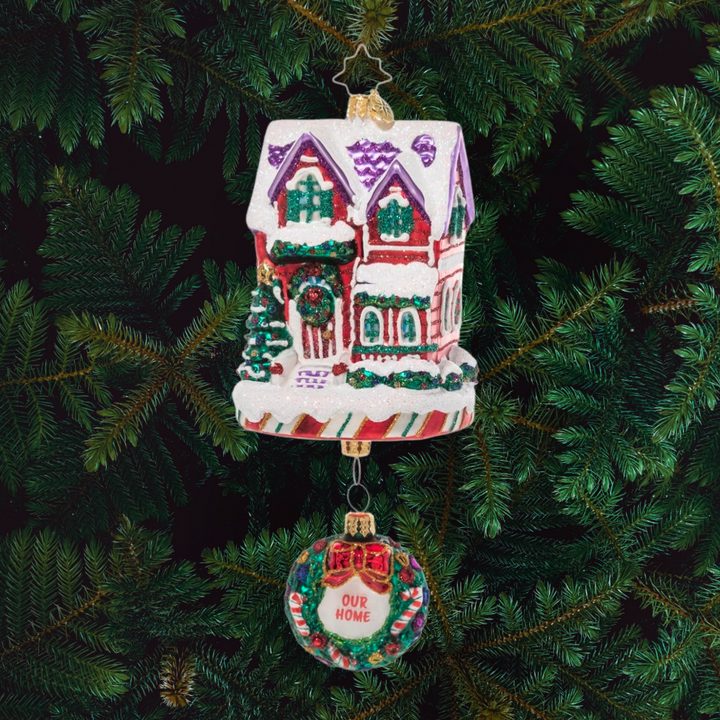 Ornament Description - The Claus' Fixer Upper: Santa works hard all year building toys, so he knows all about manual labor. This ornament features Santa and Mrs. Claus fixing up their house – perfect for the handy new homeowner.