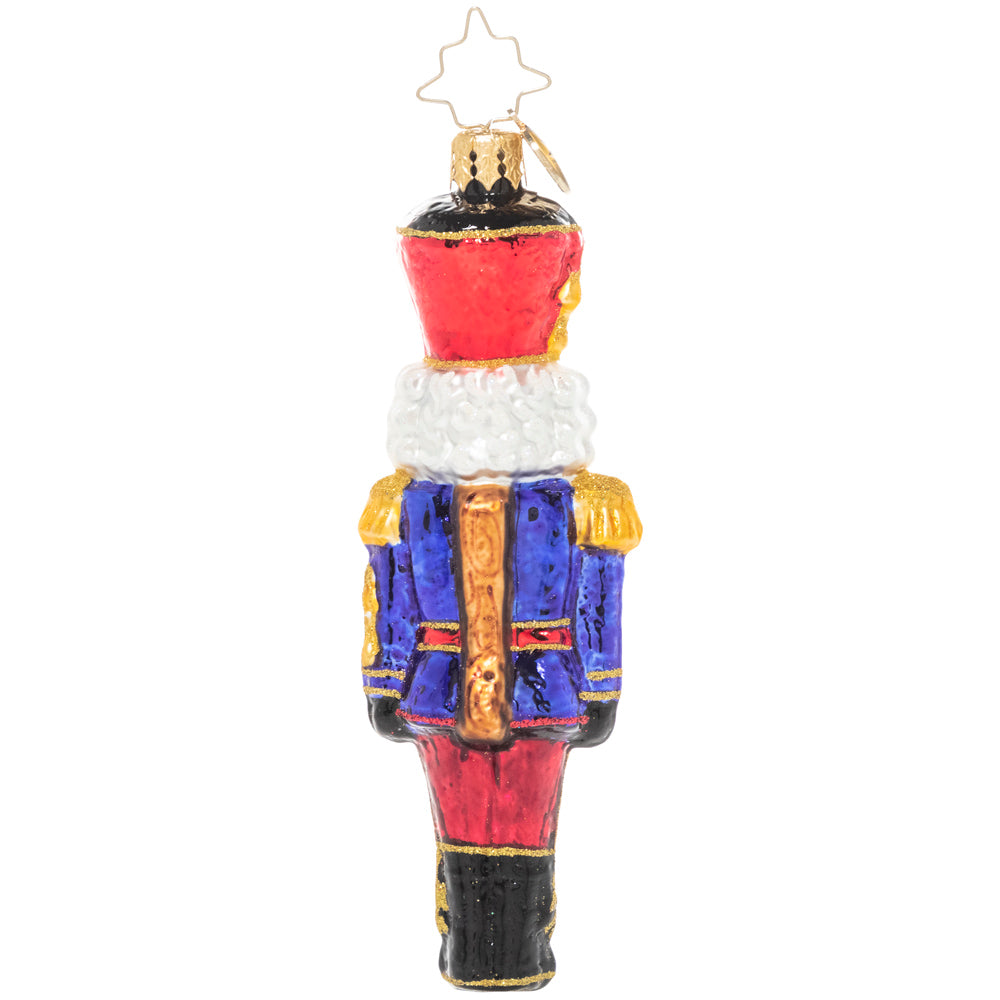 Back - Ornament Description - Classic Christmas Nutcracker: At ease, soldier! A classic mustachioed nutcracker looks smart in his Christmas uniform, ready to keep watch over your tree.