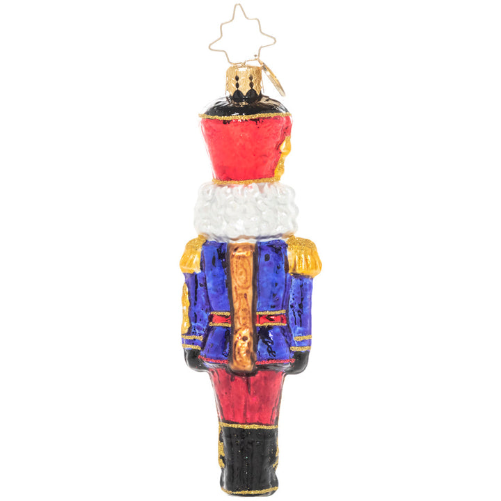 Back - Ornament Description - Classic Christmas Nutcracker: At ease, soldier! A classic mustachioed nutcracker looks smart in his Christmas uniform, ready to keep watch over your tree.