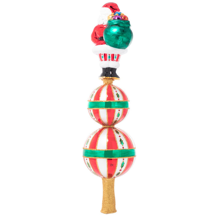 Back - Finial Description - Christmas Classics Finial: Top the tree with good cheer with this Santa finial inspired by classic Christmas tradition. Standing tall above two golden starbursts, Santa is the perfect finishing touch to your tree!