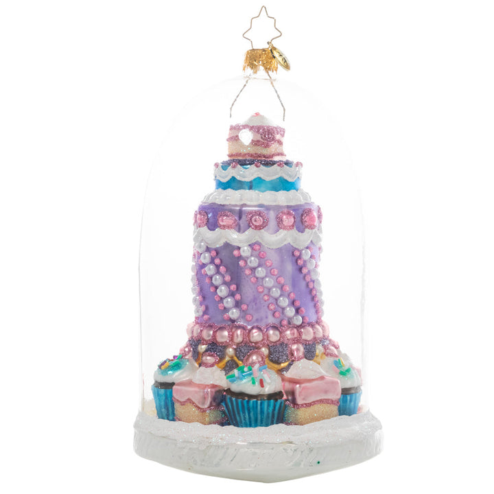Ornament Description - Perfect Patisserie: Who doesn't love admiring the beautiful sweets and treats on display behind the glass inside the local bake shop? Ooh and ahh at the pastel perfection in this adorable glass domed ornament of your own.
