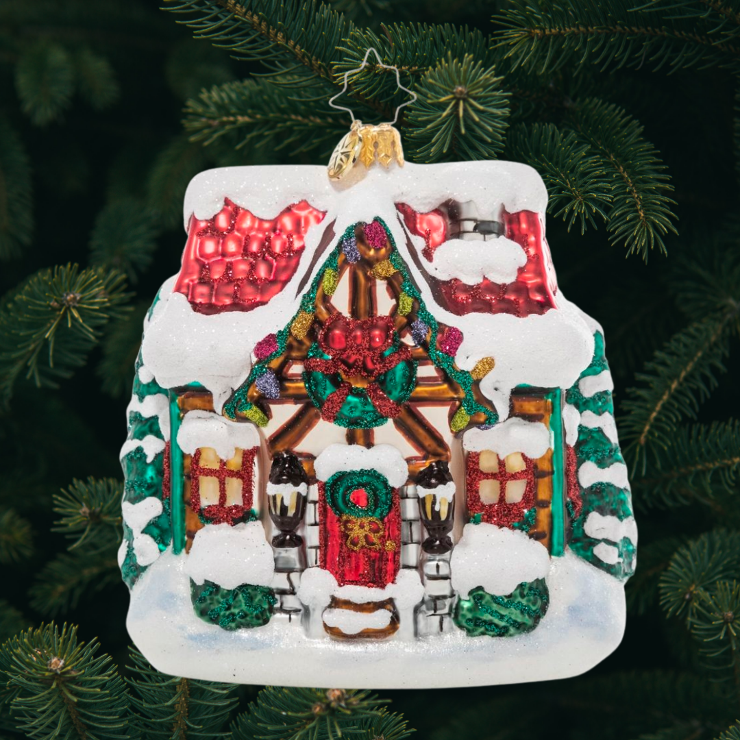 Ornament Description - The Coziest Cottage: The snow is coming down! Drifts are piling up and this little cottage is looking cozier by the minute with its holiday lights and a festive wreath.