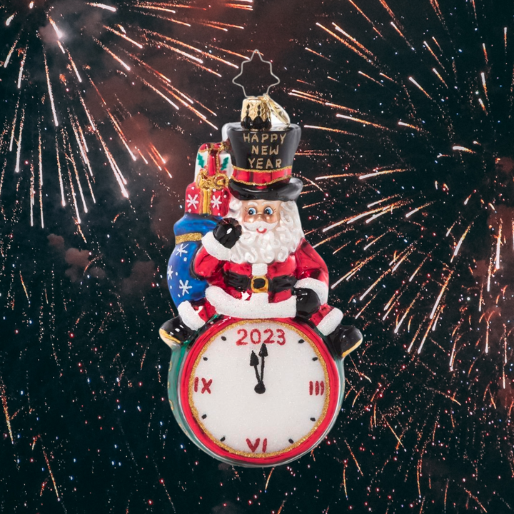 Ornament Description - Counting Down to 2023: Tick, tock, tick, tock… all eyes are on the clock! Santa merrily leads the big countdown to midnight on New Year's Eve.