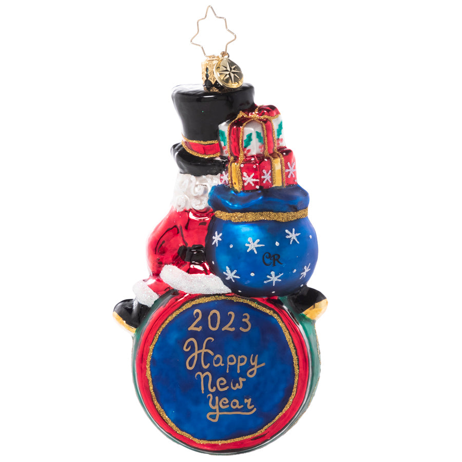 Back - Ornament Description - Counting Down to 2023: Tick, tock, tick, tock… all eyes are on the clock! Santa merrily leads the big countdown to midnight on New Year's Eve.
