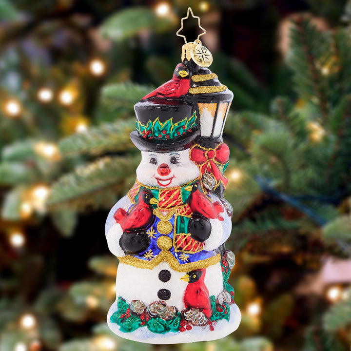 Ornament Description - Feathered Friends Snowman: Birds of a feather flock together! This smiling snowman is a delighfully darling perch for Christmas-red cardinals.