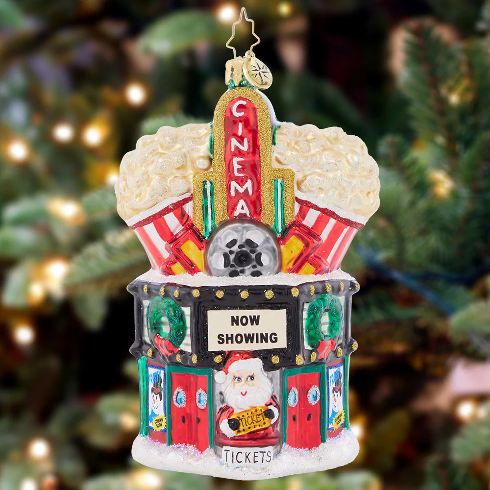 Ornament Description - Marvelous Marquee: Lights, camera, popcorn! Enjoy the classic charm of a cinema this Christmas with a theater-themed ornament. Santa is ready for the big screen!