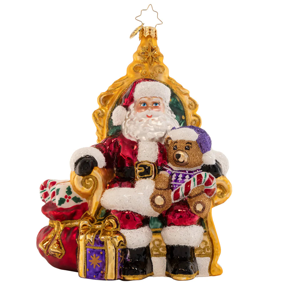 Front - Ornament Description - Strike A Pose Santa: Perfectly poised in a comfy chair surrounded by gifts, Santa is ready to listen to the Christmas wish lists from the good little girls and boys.