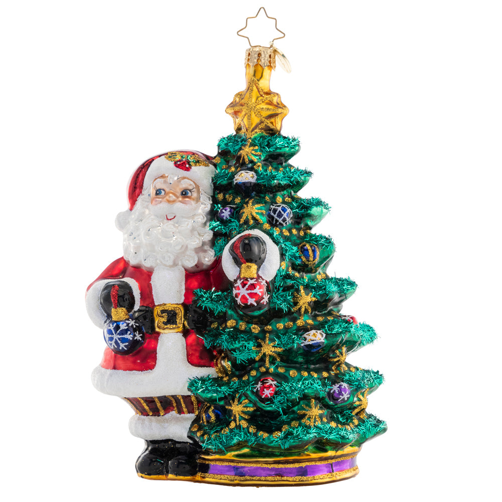 Front - Ornament Description - Deck the Halls Santa: Santa is ready to show off his extensive ornament collection as he trims his Christmas tree with beautiful glass baubles.