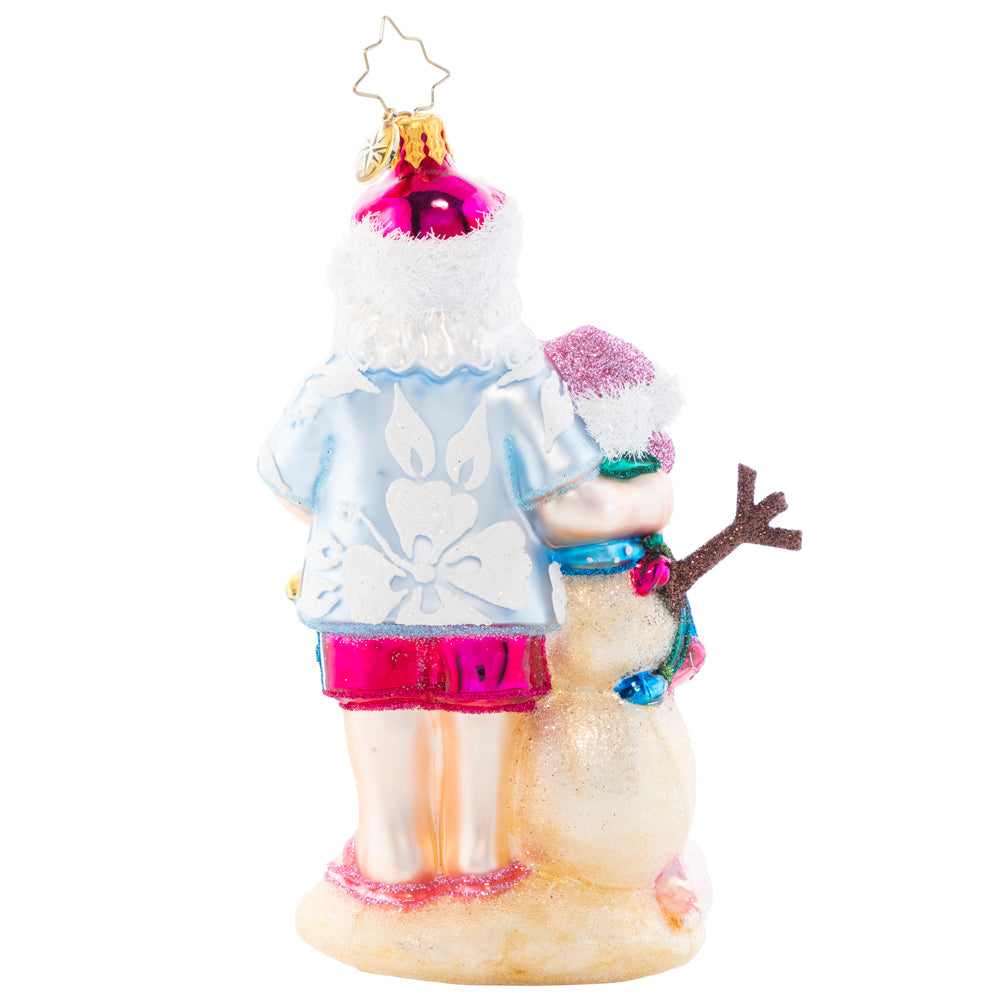 Back - Ornament Description - Sandy Snow Team: Hang back with this Santa on the beach as the waves are in reach. Build a sandyman as best as you can, to create a cheery team with a Christmas plan. 