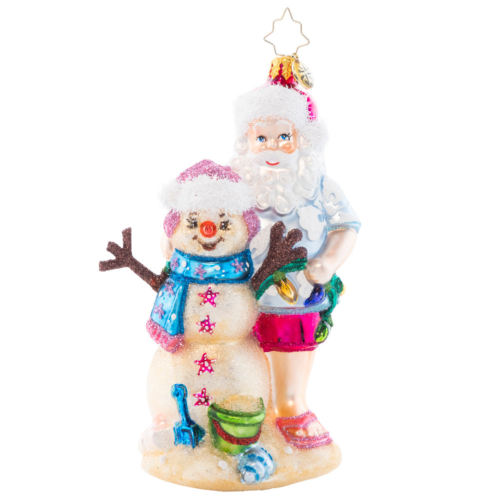 Front - Ornament Description - Sandy Snow Team: Hang back with this Santa on the beach as the waves are in reach. Build a sandyman as best as you can, to create a cheery team with a Christmas plan. 