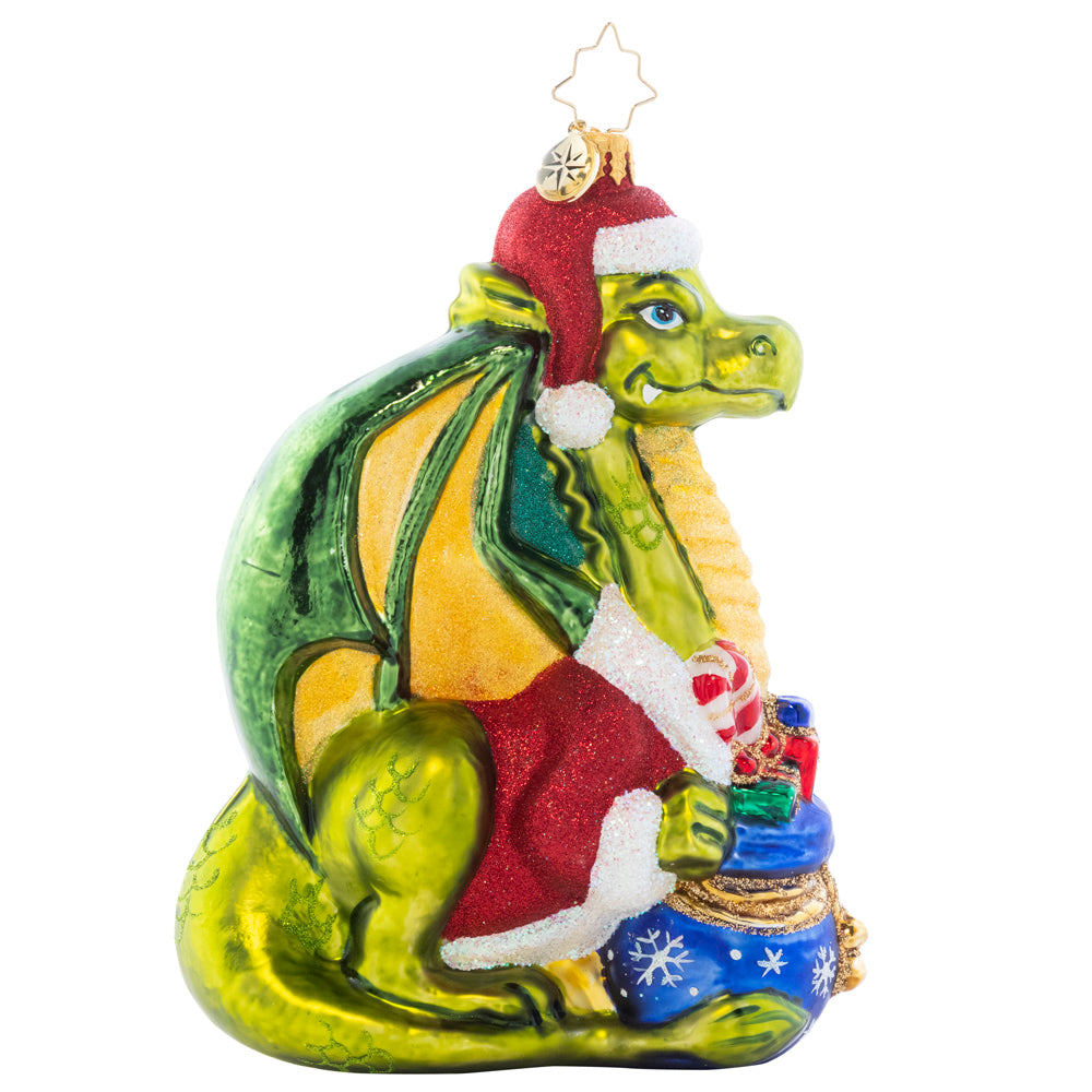 Side 1 of 2 - Ornament Description - Fire-Breathing Friend: Never fear, this majestic green dragon is only here to spread Christmas cheer! He's an absolutely resplendant reptile in a red coat and festive Santa hat.