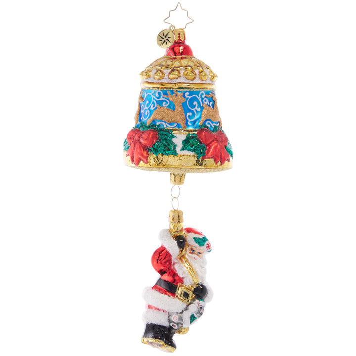Front - Ornament Description - Swinging Santa: Swinging from a beautiful Christmas bell adorned with deer and red roses, Santa is ringing in the holiday for all to hear.