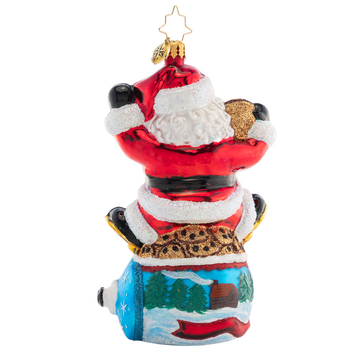 Back - Ornament Description - Santa's Snack Break: Delivering presents all around the world is hard work! Santa is taking a much-needed break atop a cookie jar decorated with a wintertime scene.