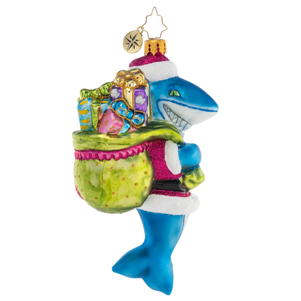 Side View 1 of 2 - Ornament Description - Santa Jaws: Shining and smiling with a bag full of gifts, this jolly Santa-Jaws ornament is nothing to be afraid of! He's spreading Christmas cheer all across the deep blue sea with his bounty of presents.