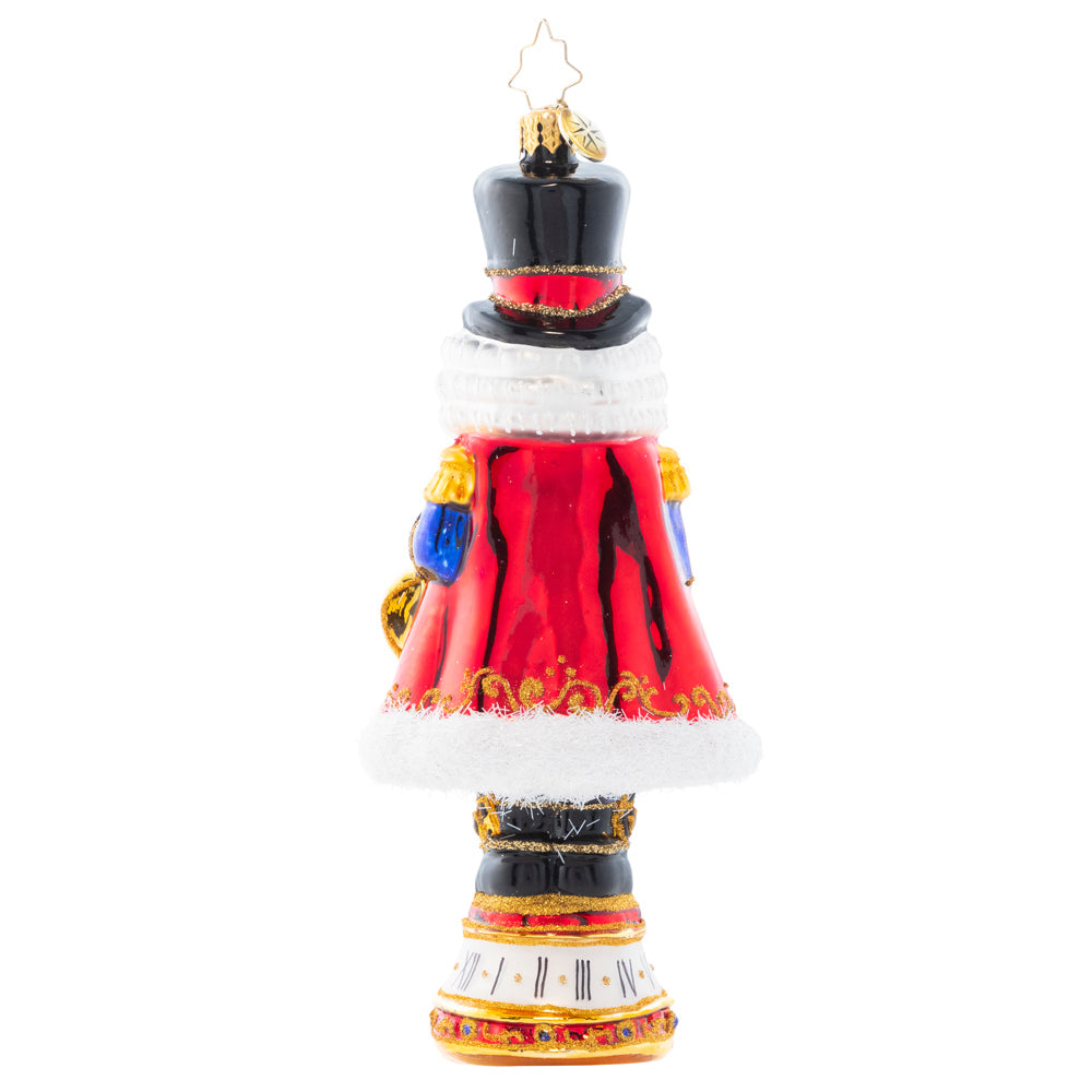 Back - Ornament Description - Countdown to Christmas: Keeping time with his golden pocket watch, this stately nutcracker is counting down the minutes until Christmas Day!