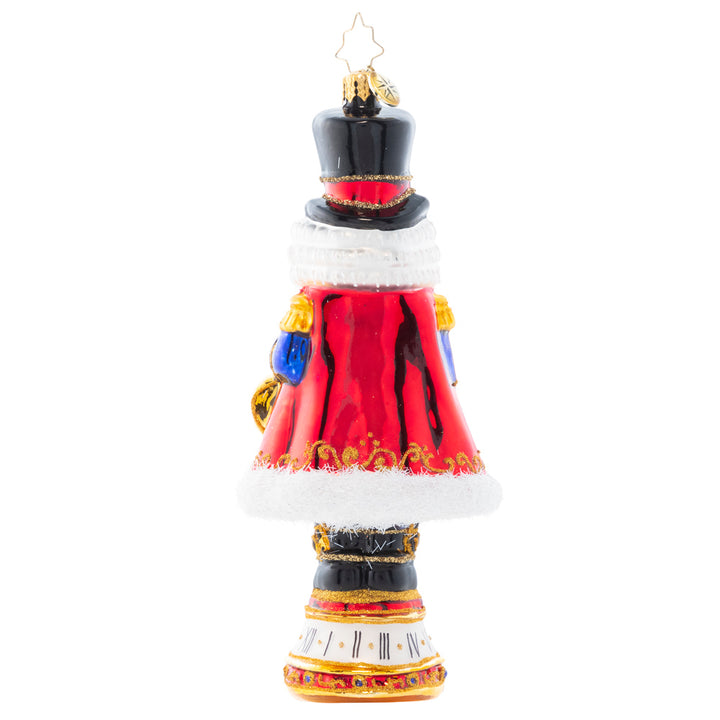Back - Ornament Description - Countdown to Christmas: Keeping time with his golden pocket watch, this stately nutcracker is counting down the minutes until Christmas Day!
