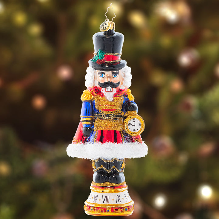 Ornament Description - Countdown to Christmas: Keeping time with his golden pocket watch, this stately nutcracker is counting down the minutes until Christmas Day!