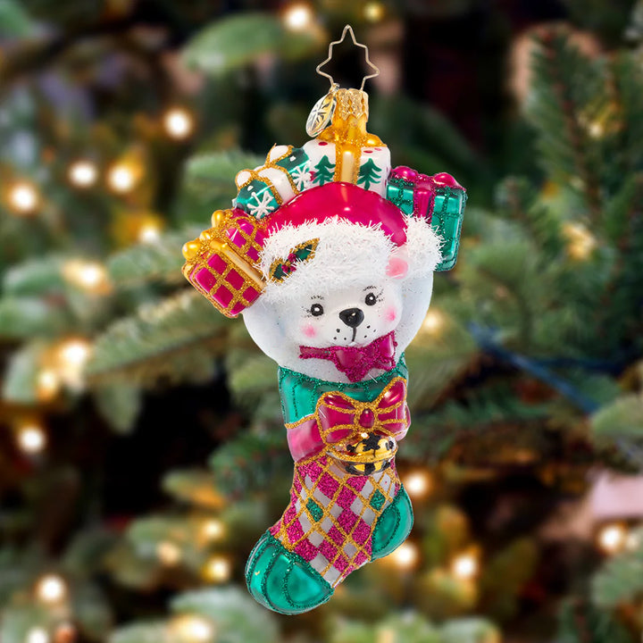 Ornament Description - Stocking Stuffer: A polar bear surprise is a welcomed holiday prize! With gifts in store in this stocking, that'll have all the recipients talking.