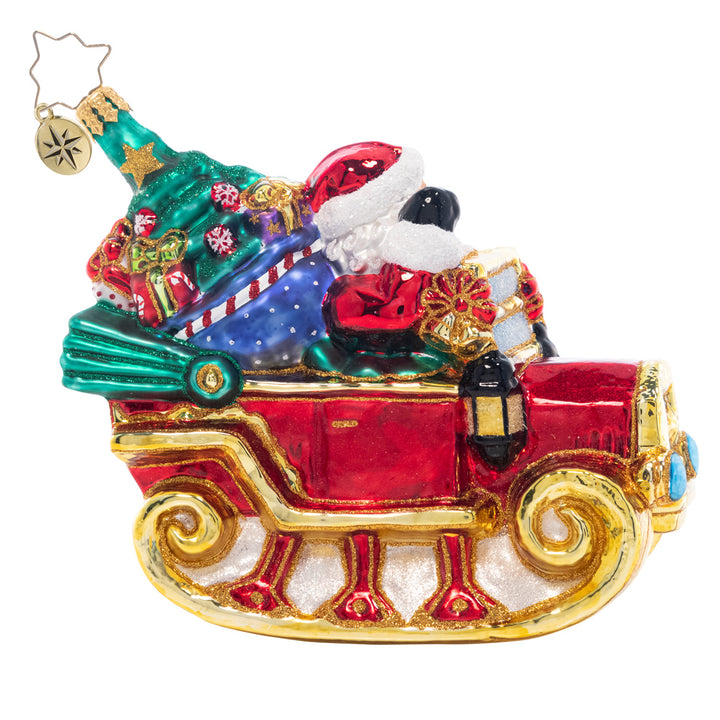 Back - Ornament Description - Ready to Ride Santa: Beep beep! Santa's droptop sleigh-mobile is modeled after a vintage car. He'll have no problem getting through the snowy night in this sweet ride!