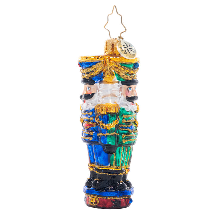 Back - Ornament Description - Three Nutty Knights Gem: Standing guard in red, blue, and green, these stylish and stoic nutcrackers have each other's backs – the perfect protectors for the gifts under your Christmas tree!