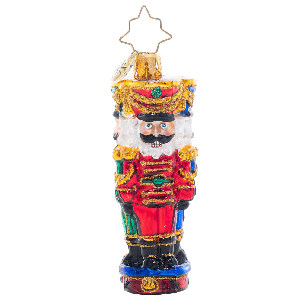 Front - Ornament Description - Three Nutty Knights Gem: Standing guard in red, blue, and green, these stylish and stoic nutcrackers have each other's backs – the perfect protectors for the gifts under your Christmas tree!