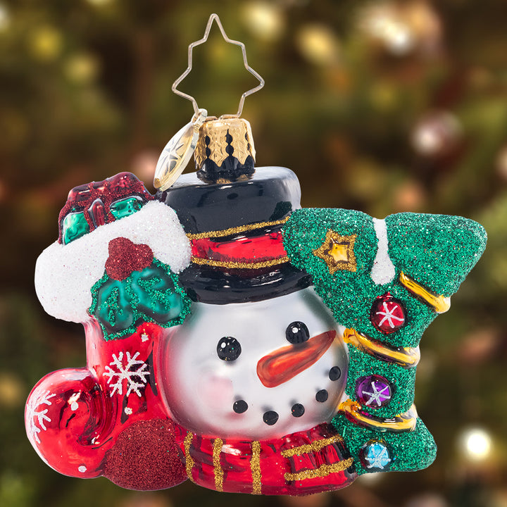 Ornament Description - A Joyful Holiday Gem: You can't spell "jolly" without J-O-Y! A similing smowman peeks out from this joyous Little Gem, which spells out the spirit of the holiday season.