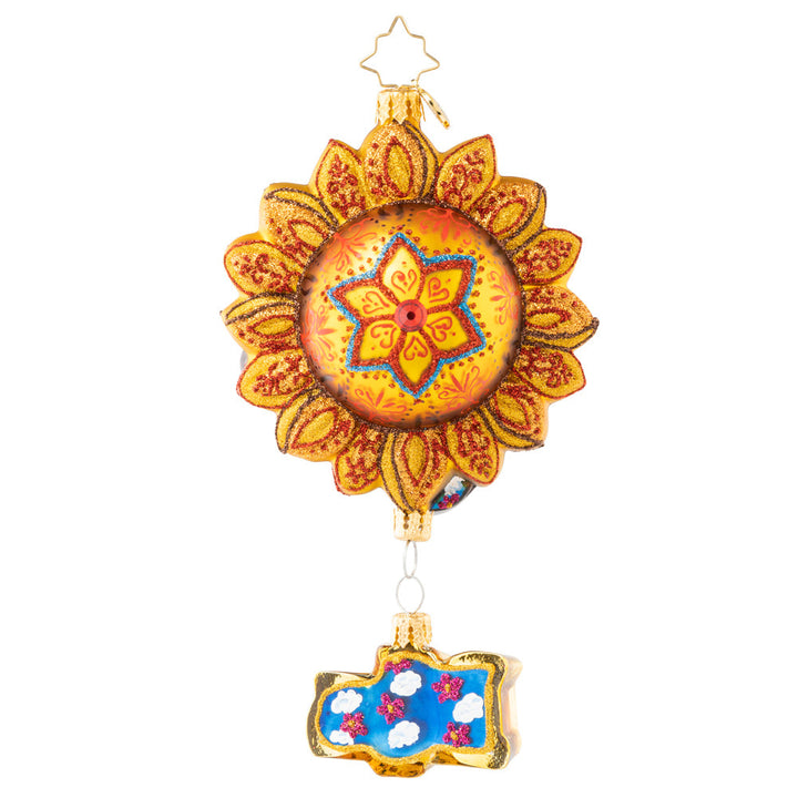 Back - Ornament Description - The Beatles' Sun King: The sun is up, the sky is blue, and this mystical musician has a tune for you. Across the universe, his sweet song rings out, making the whole world twist n' shout. And before he sets, he pleads, "remember: love is all you need."