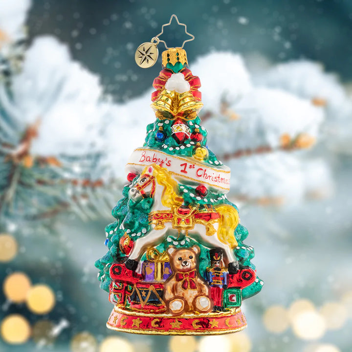 Ornament Description - Tot's First Tree: Adorned with an adorable teddy bear and radiant rocking horse, this festive tree commemorates baby's first Christmas.