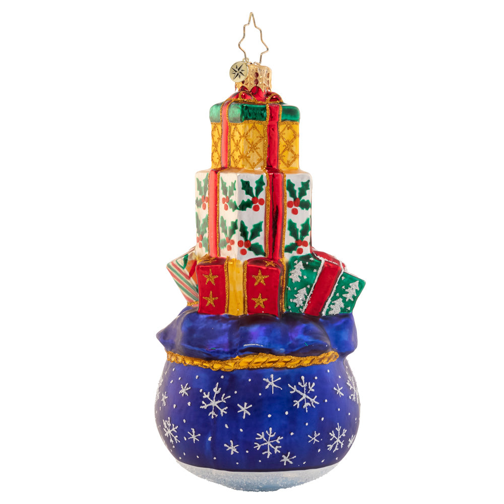 Back - Ornament Description - Gift Delivery: This tower of good tidings is full to the brim with Christmas presents. Looks like there were lots of good little girls and boys on the nice list this year!