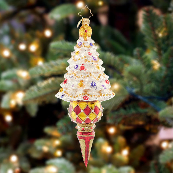 Ornament Description - Winter Elegance Tree: This tastefully-trimmed snow white tree glitters with gems and tinsel atop an elegant drop-shaped base. Add elegance and flair to your collection with this standout piece.