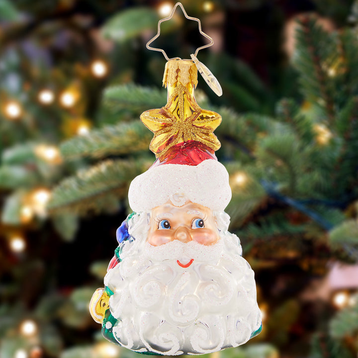Ornament Description - Christmas All Around Gem: This clever Christmas ornament features two classic icons of the holiday season – a smiling Santa Claus and a tastefully-trimmed tree! This lovely Little Gem can be appreciated from all angles.
