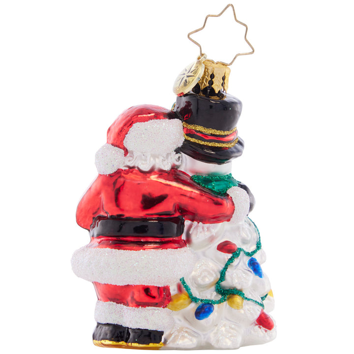 Back - Ornament Description - A Frosty Duo Gem: The smiling Santa and Snowman are a perfect holiday pair, surrounded by beautifully-wrapped gifts and Christmas lights. 'Tis the season for festive friendship!