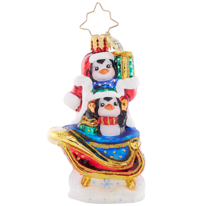 Front - Ornament Description - Silliest Sleight Ride Gem: This pair of playful penguins are getting up to some merry-mischief, disguising themselves as Santa Claus in his trademark red coat! Strap in to the sleigh for a silly ride through the snow.