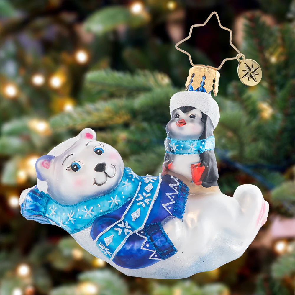 Ornament Description - Perfect Polar Pals Gem: Laid-back and lounging in a snowflake-covered Christmas sweater and scarf, these polar bear and penguin pals are the definition of chill.