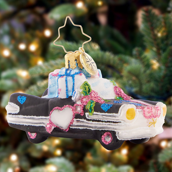 Ornament Description - Wedding Day Getaway Gem: This very vintage wedding getaway ride is the perfect gift for a just-hitched couple! Commemorate everlasting love with this adorable retro automobile.