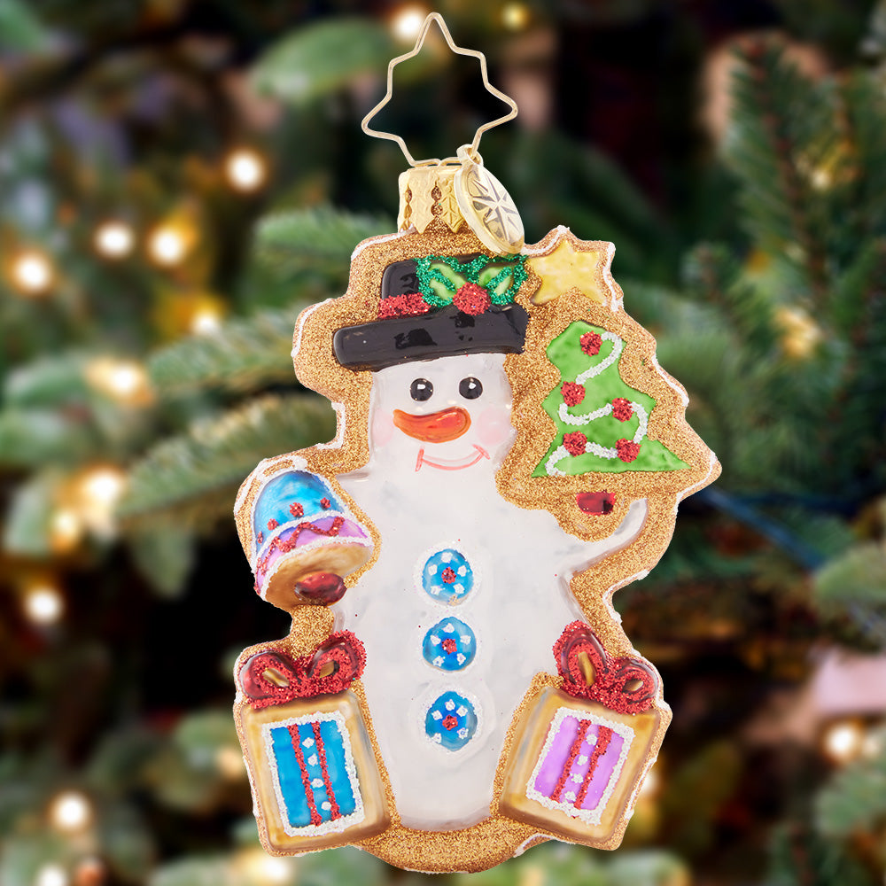 Ornament Description - Gingerbread Snowman Gem: This sweet, smiling gingerbread snowman gem looks just like a real Christmas cookie! Decorated with snow-white "icing" and sparkling sprinkles, this ornament is a deliciously darling addition to any tree.