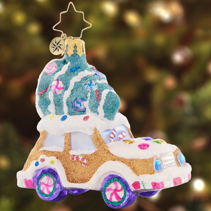 Ornament Description - Candy Tree Delivery Gem: Yippee! Time to take the tree home to the Candy Chalet for Christmastime. This gingerbread-mobile is the sweetest ride to get the job done!