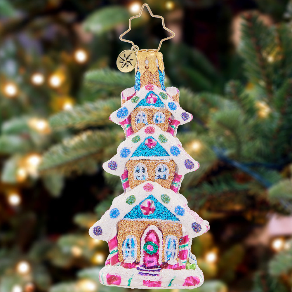 Ornament Description - Sweetest Highrise Gem: This darling dwelling is a three-tiered tower of gingerbread goodness! Decorated with gooey gumdrops and peppermint icing swirls, this extravagant treat is an adorable addition to your tree.