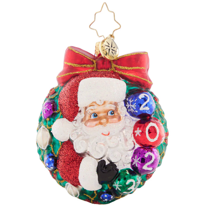 Front - Ornament Description - Smiling Through 2023 Gem: Perfectly perched within a wintry wreath, Santa celebrates 2023 with gorgeous, glistening ornaments.