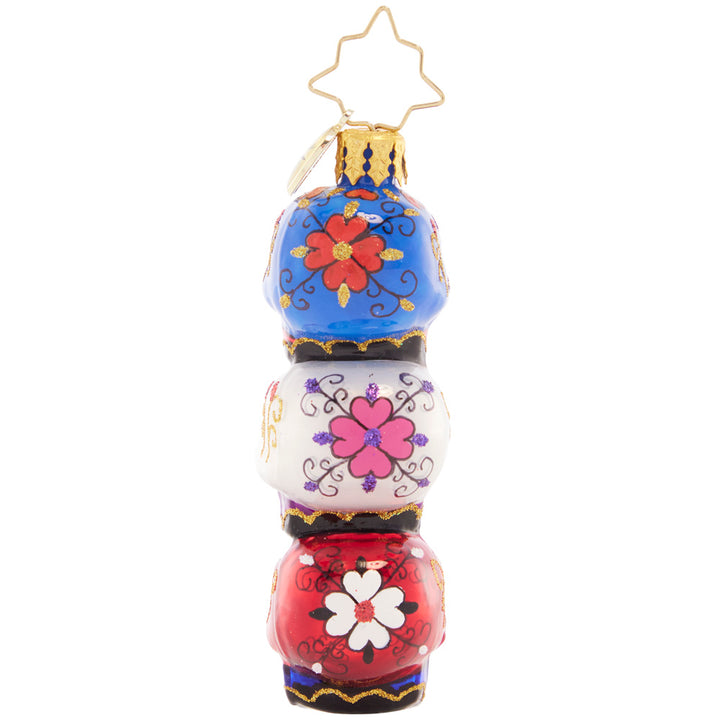 Back - Ornament Description - Spooky Sugar Skulls Gem: These three sparkly skulls are a spooky stack to adorn your tree! Painted ornately to pay homage to the Day of the Dead, this is a unique and beautiful piece.