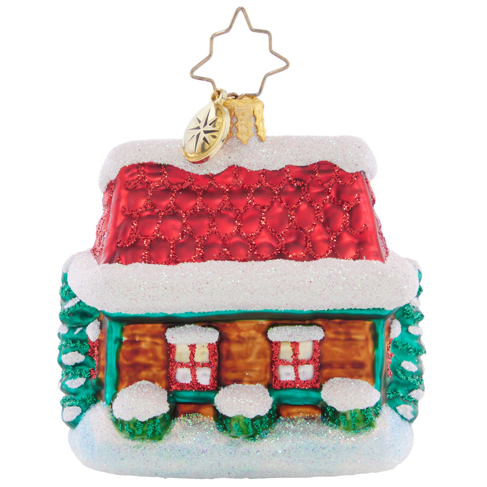 Back - Ornament Description - The Coziest Cottage Gem: Covered in deep snow drifts, this little cottage is cozy warm on the inside. The perfect spot to warm up with some milk and cookies on Christmas Eve!