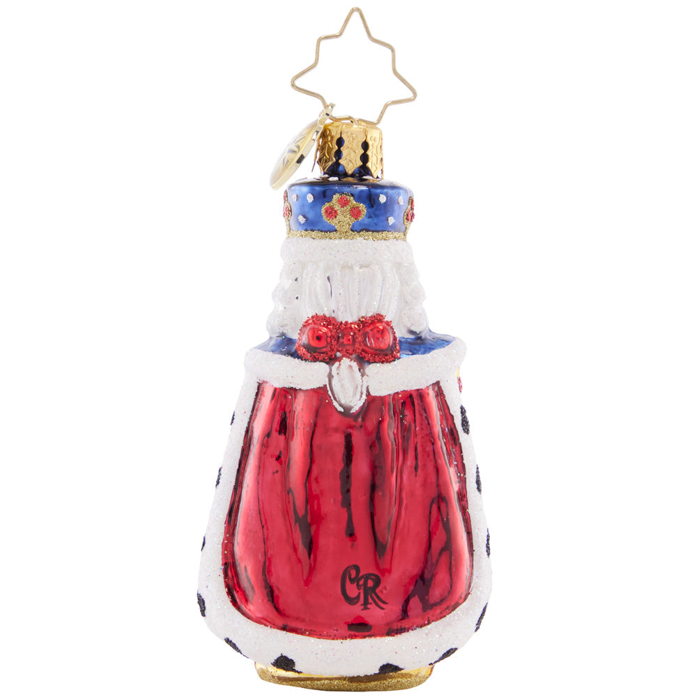 Back - Ornament Description - Nutcracking Royalty Gem: All hail this regal nutcracker! This little gem spares none of the pomp and circumstance, presenting a regal protector dressed in royal blue and a fur-lined cape.