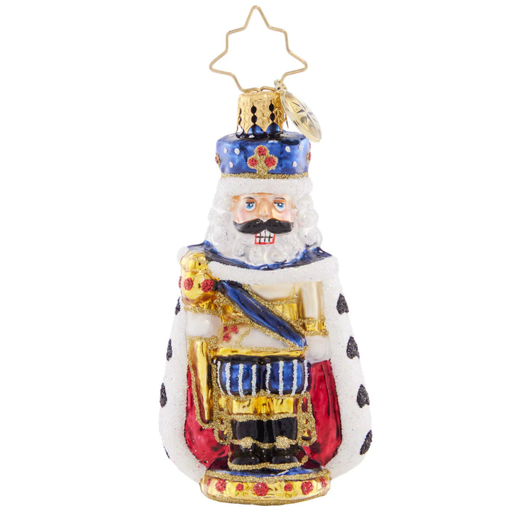 Front - Ornament Description - Nutcracking Royalty Gem: All hail this regal nutcracker! This little gem spares none of the pomp and circumstance, presenting a regal protector dressed in royal blue and a fur-lined cape.
