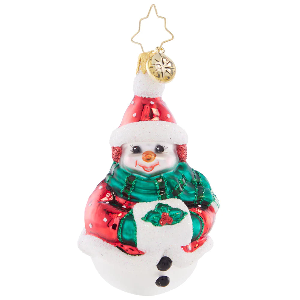 Ornament Description - Holly Jolly Snowman Gem: With a decorative sprig of holly, this smiling snow friend sure is jolly! Bundled up with a warm scarf and festive muff, this little cutie doesn't mind the cold.