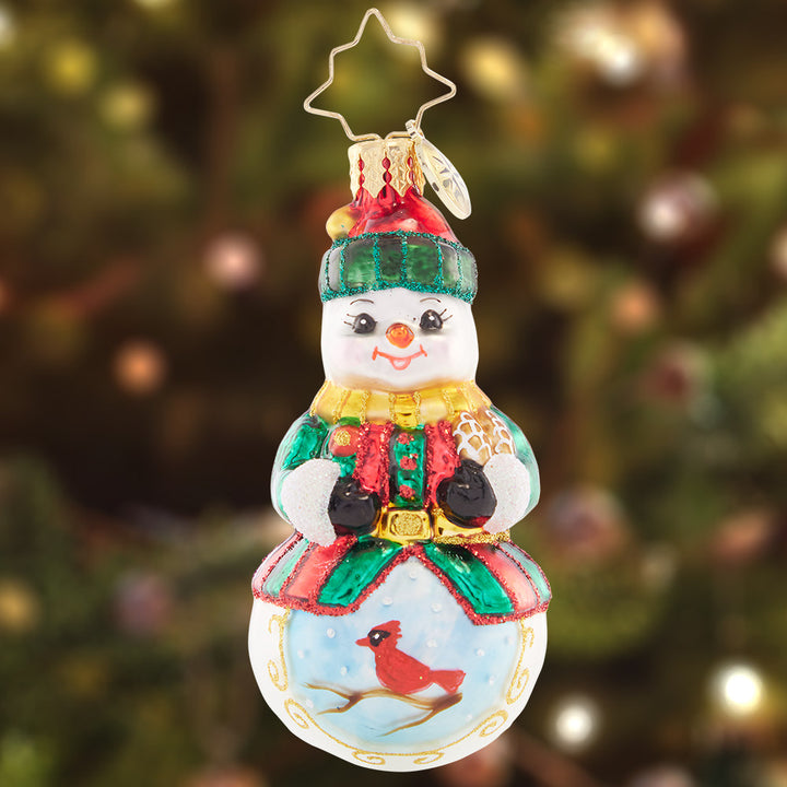 Ornament Description - Guardian of the Forest Gem: A vignette of a crimson-red cardinal decorates this friendly snowman. He cares for all the woodland creatures, especially those that stay throughout the season.