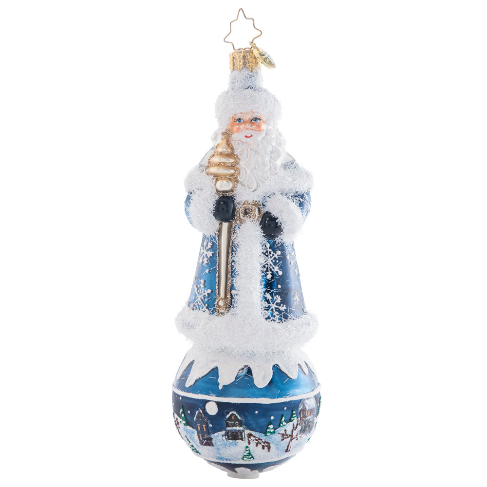 Front - Ornament Description - Snowy Serenity Santa: This snowflake-covered Santa stands upon a serene scene round, showcasing a beautiful silent night. This piece is an intricate and charming addition to any tree!