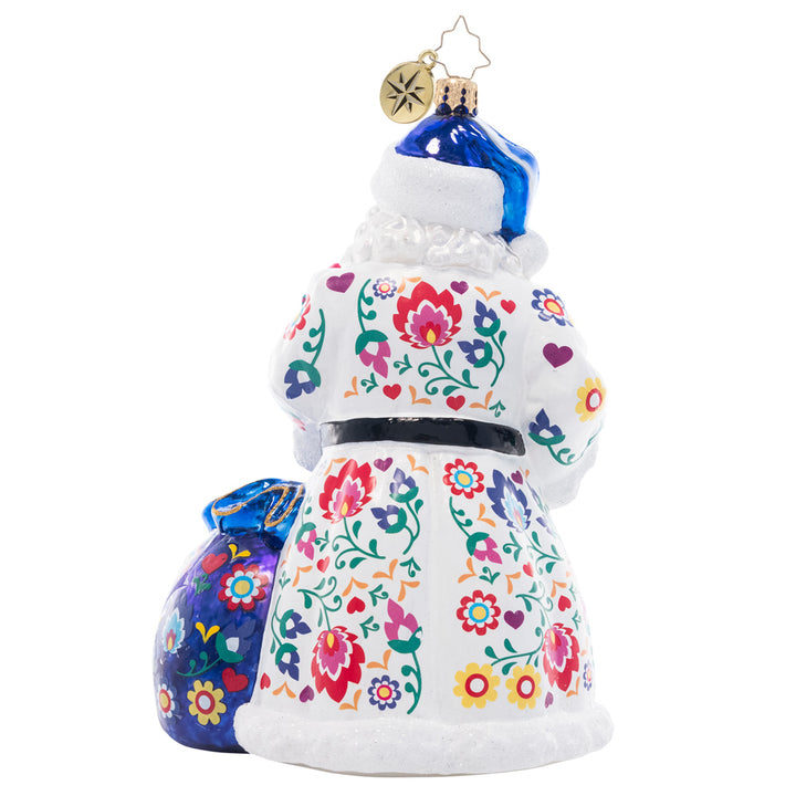 Back - Ornament Description - Floral Folk Santa: Santa is looking festive as ever in a cozy ensemble fashioned in the style of floral European folk art. Uniquely colorful and hand-painted with care, this piece is a truly unique addition to your collection.