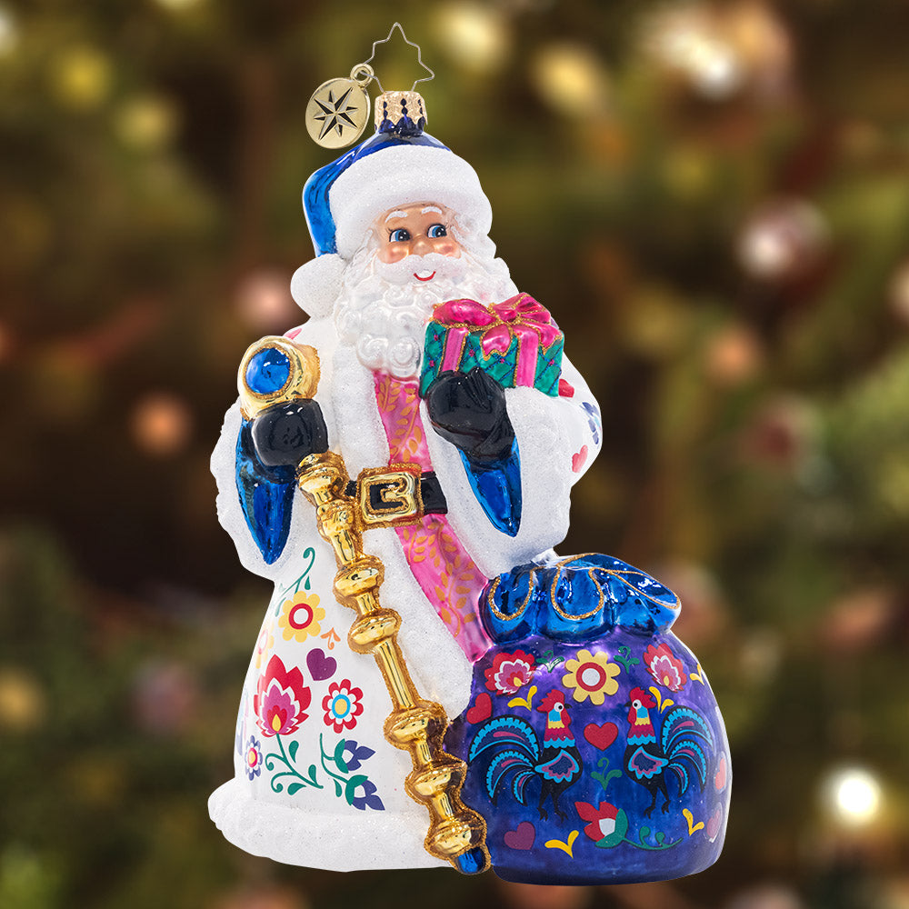 Ornament Description - Floral Folk Santa: Santa is looking festive as ever in a cozy ensemble fashioned in the style of floral European folk art. Uniquely colorful and hand-painted with care, this piece is a truly unique addition to your collection.